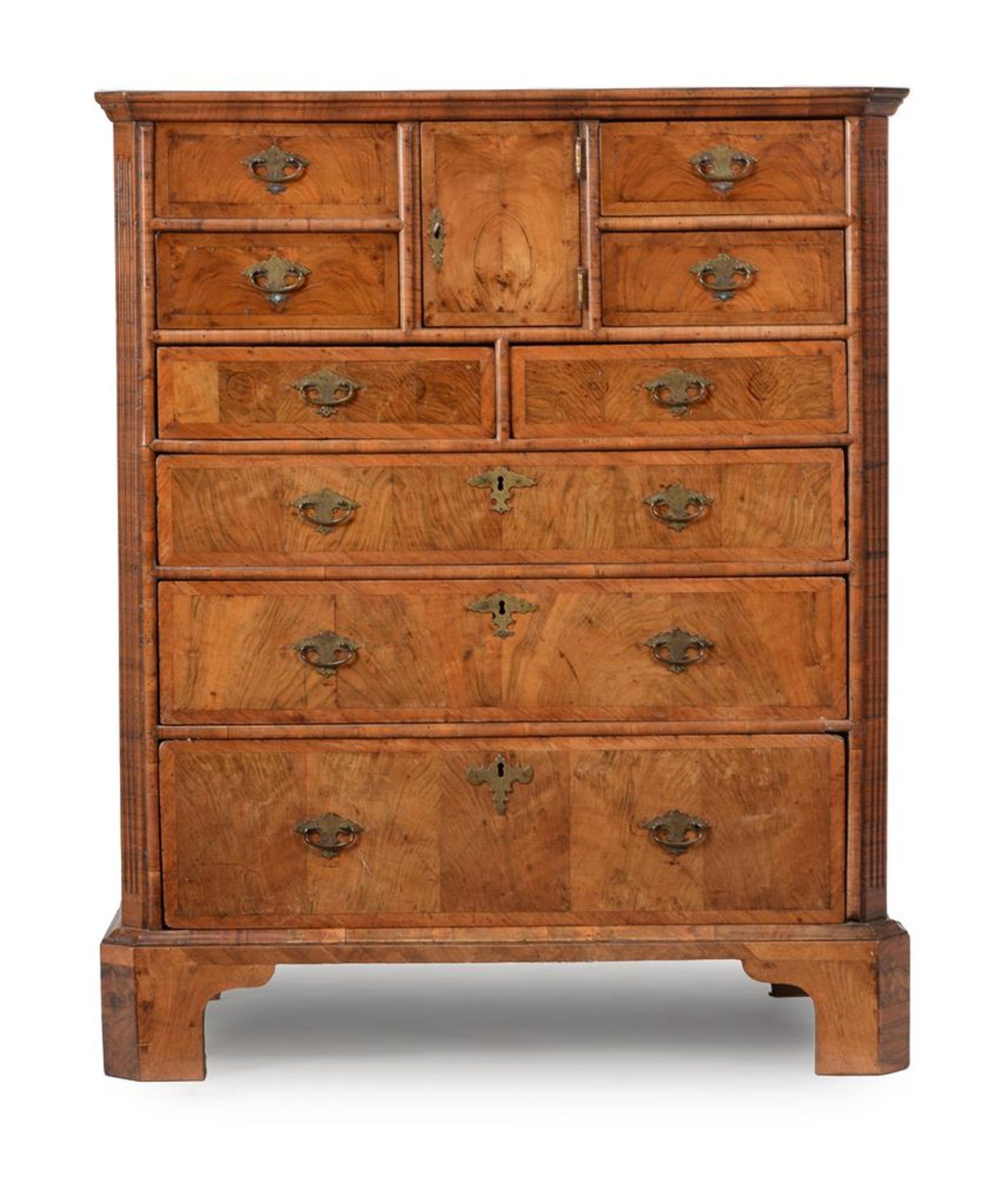 A WALNUT CHEST OF DRAWERS