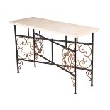 A WROUGHT IRON AND PARCEL GILT LOW TABLEBY CHARLES SAUNDERS