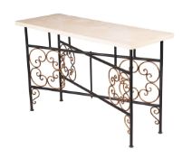 A WROUGHT IRON AND PARCEL GILT LOW TABLEBY CHARLES SAUNDERS