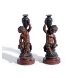AFTER AUG. MOREAU, A PAIR OF PATINATED MODELS OF CHILDREN HOLDING AMPHORA