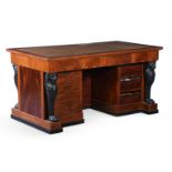 AN EMPIRE STYLE MAHOGANY AND EBONISED DESK