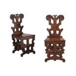 A PAIR OF VICTORIAN OAK HALL CHAIRS