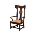 A GEORGE III OAK LAMBING CHAIR