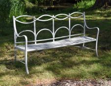 A WHITE PAINTED STRAPWORK BENCH