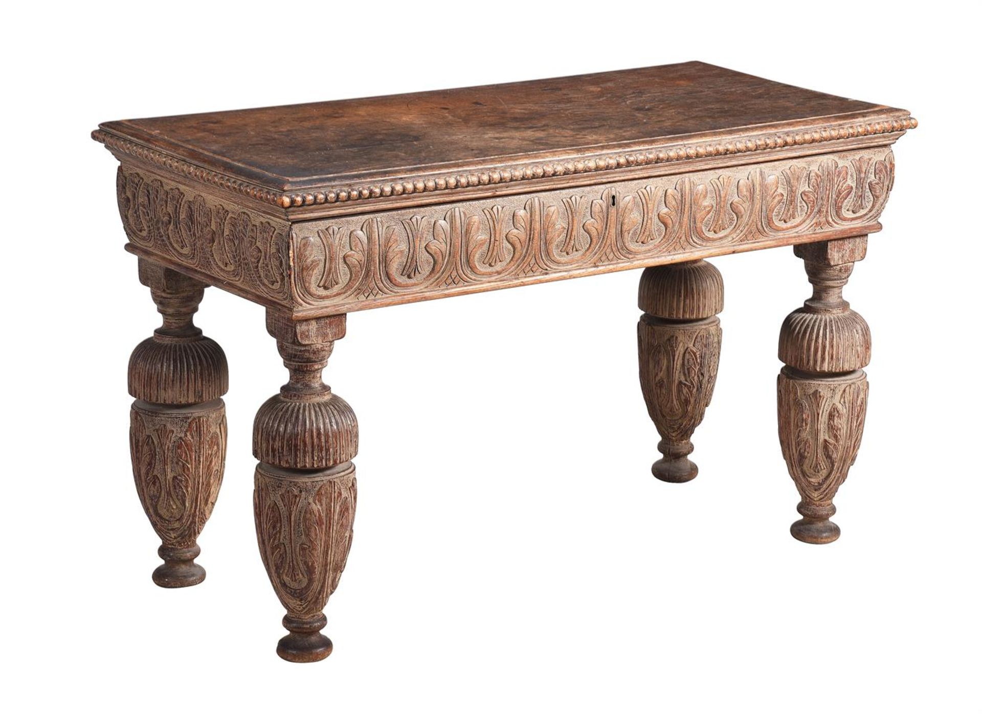 A CARVED AND PARCEL LIMED WOOD SIDE TABLE IN ELIZABETHAN TASTE