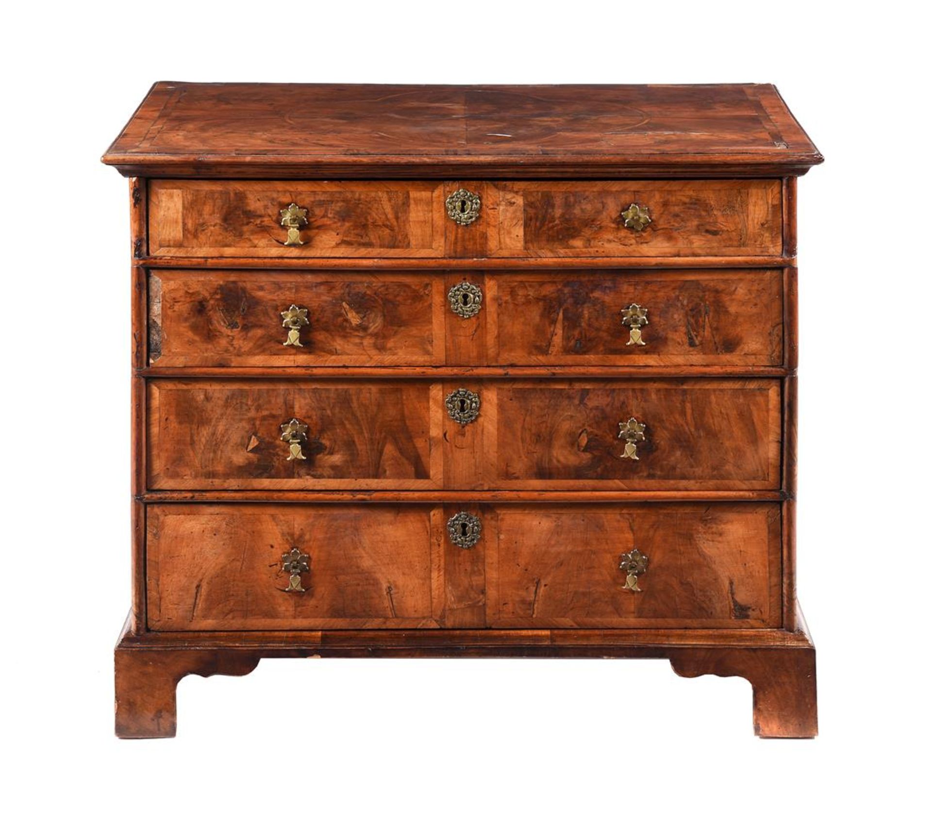 A WALNUT CHEST OF DRAWERS