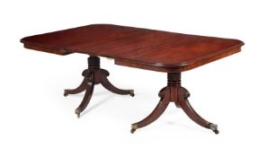 A GEORGE IV MAHOGANY TWO PILLAR EXTENDING DINING TABLE