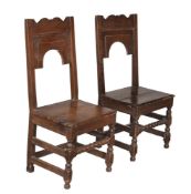 A PAIR OF OAK PANELLED CHAIRS