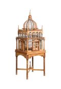 A STRIPPED SOFTWOOD BIRDCAGE ON STAND