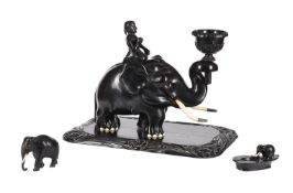A CARVED EBONY AND BONE MOUNTED MODEL OF A MAHOUT