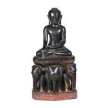 A CARVED WOOD MODEL OF A BUDDHA