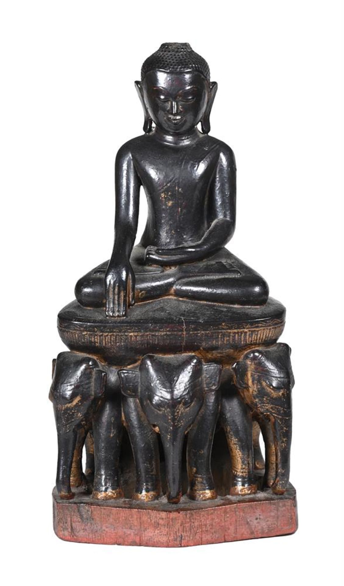 A CARVED WOOD MODEL OF A BUDDHA