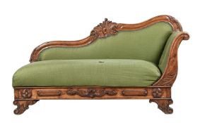 A VICTORIAN CARVED WALNUT CHAISE LONGUE