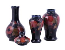A GROUP OF FOUR MOORCROFT POMEGRANATE VASES