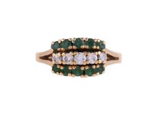 A MID 20TH CENTURY DIAMOND AND EMERALD DRESS RING