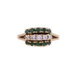 A MID 20TH CENTURY DIAMOND AND EMERALD DRESS RING