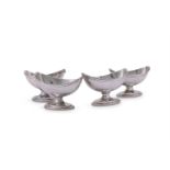 A SET OF FOUR GEORGE III SILVER NAVETTE SALTS