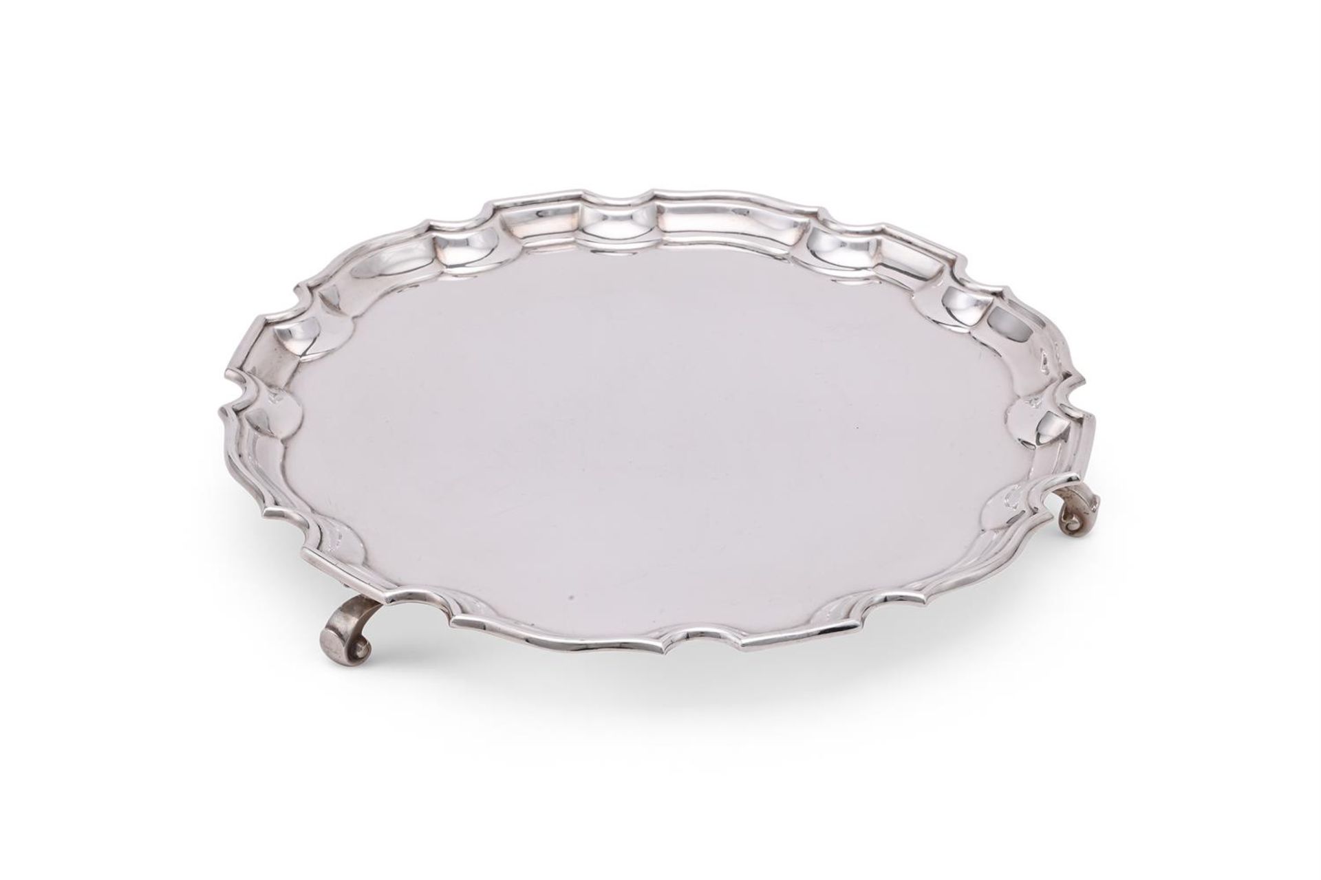 A SILVER SHAPED CIRCULAR SALVER