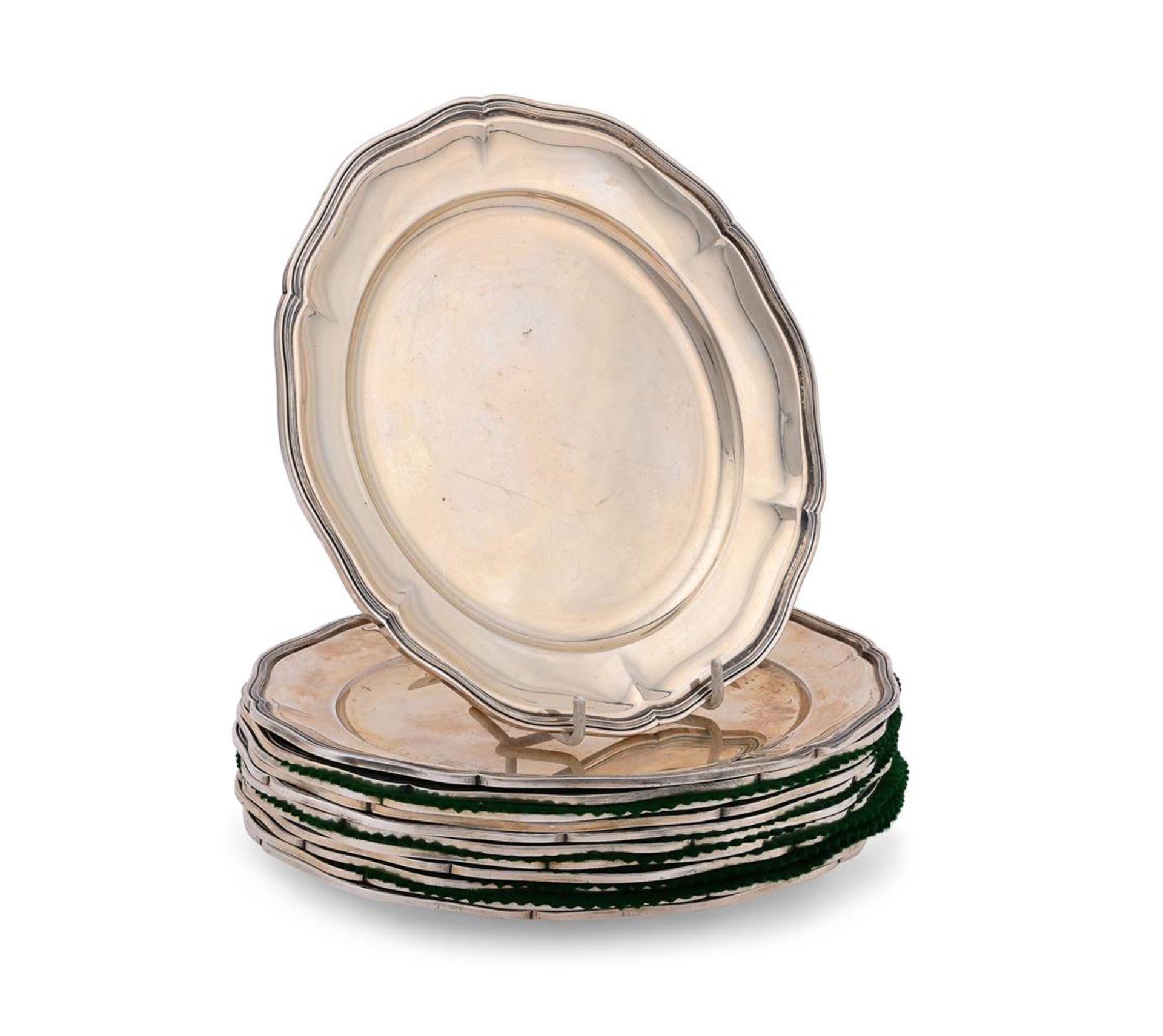 A SET OF TWELVE SILVER COLOURED SHAPED CIRCULAR PLATES