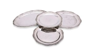 A SET OF FOUR SILVER COLOURED TRAYS
