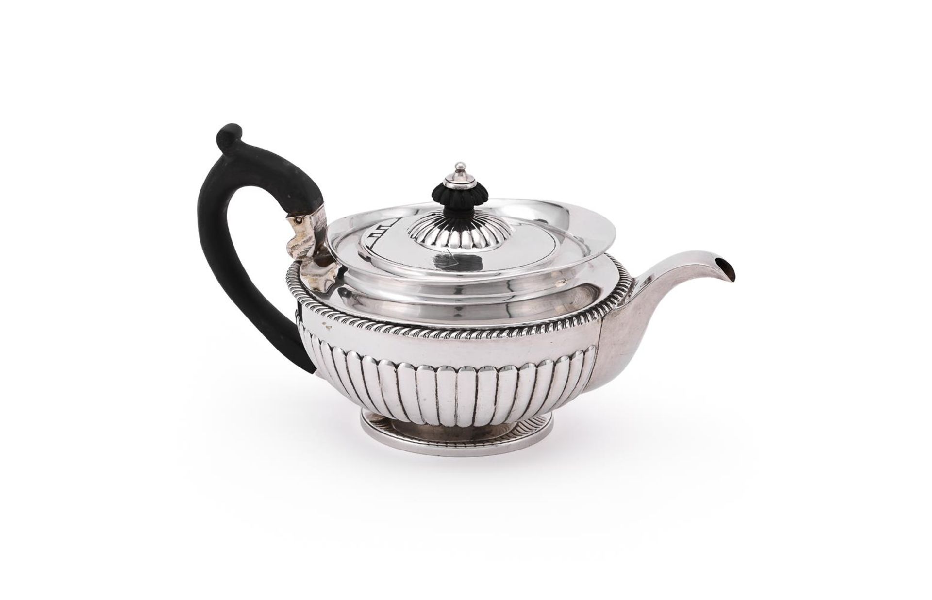 A GEORGE IV SILVER CIRCULAR TEA POT