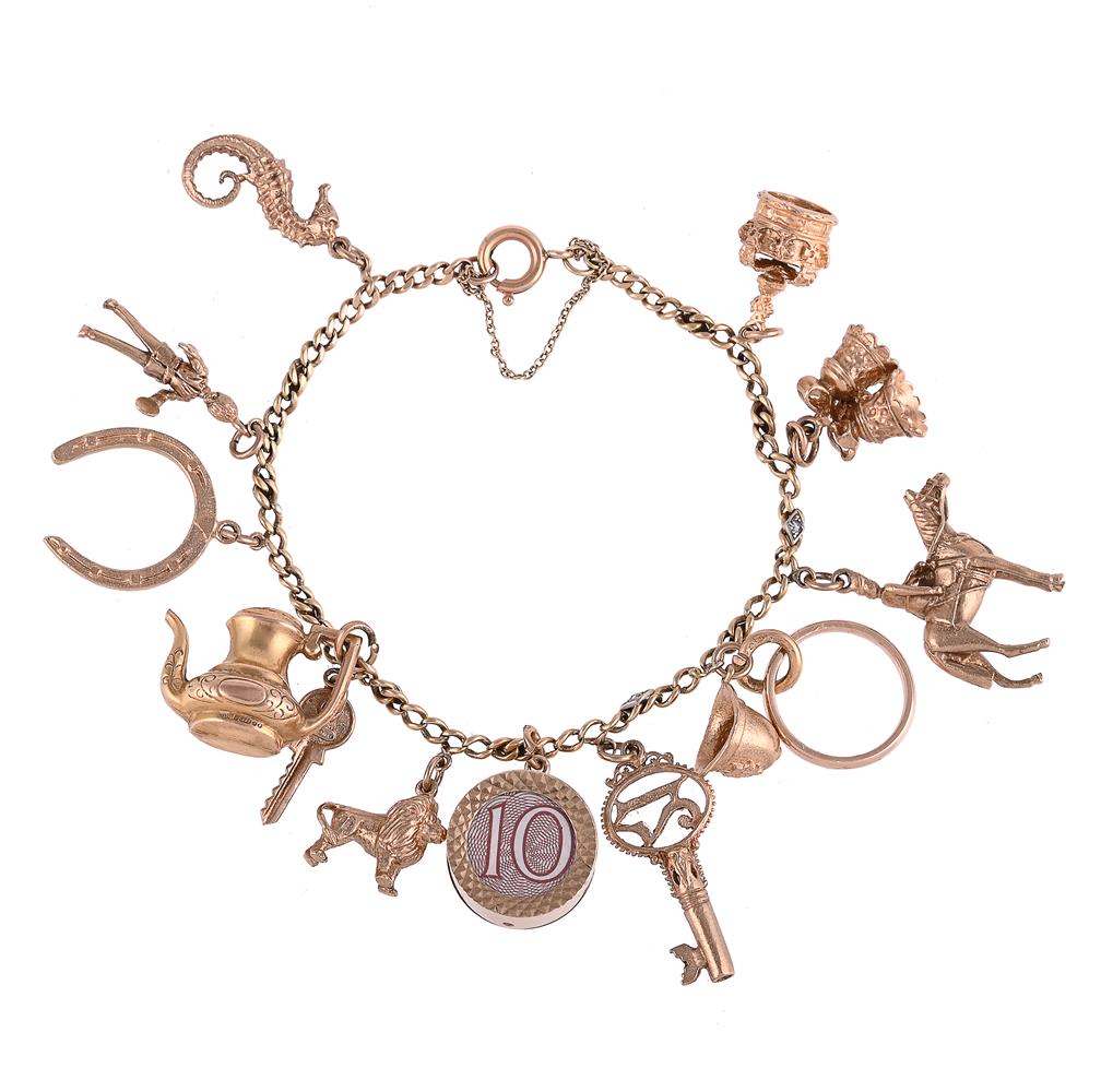 A CURB LINK CHARM BRACELET