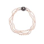 A THREE ROW CULTURED PEARL NECKLACE