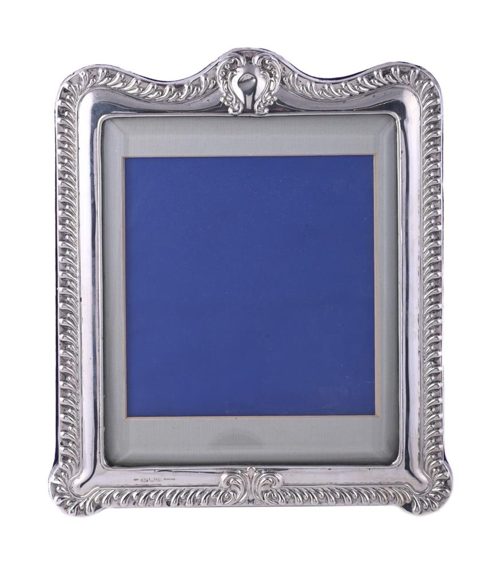 A VICTORIAN SILVER MOUNTED SHAPED RECTANGULAR PHOTO FRAME