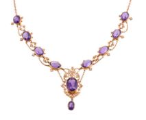 AN EDWARDIAN AMETHYST AND SEED PEARL NECKLACE, CIRCA 1910