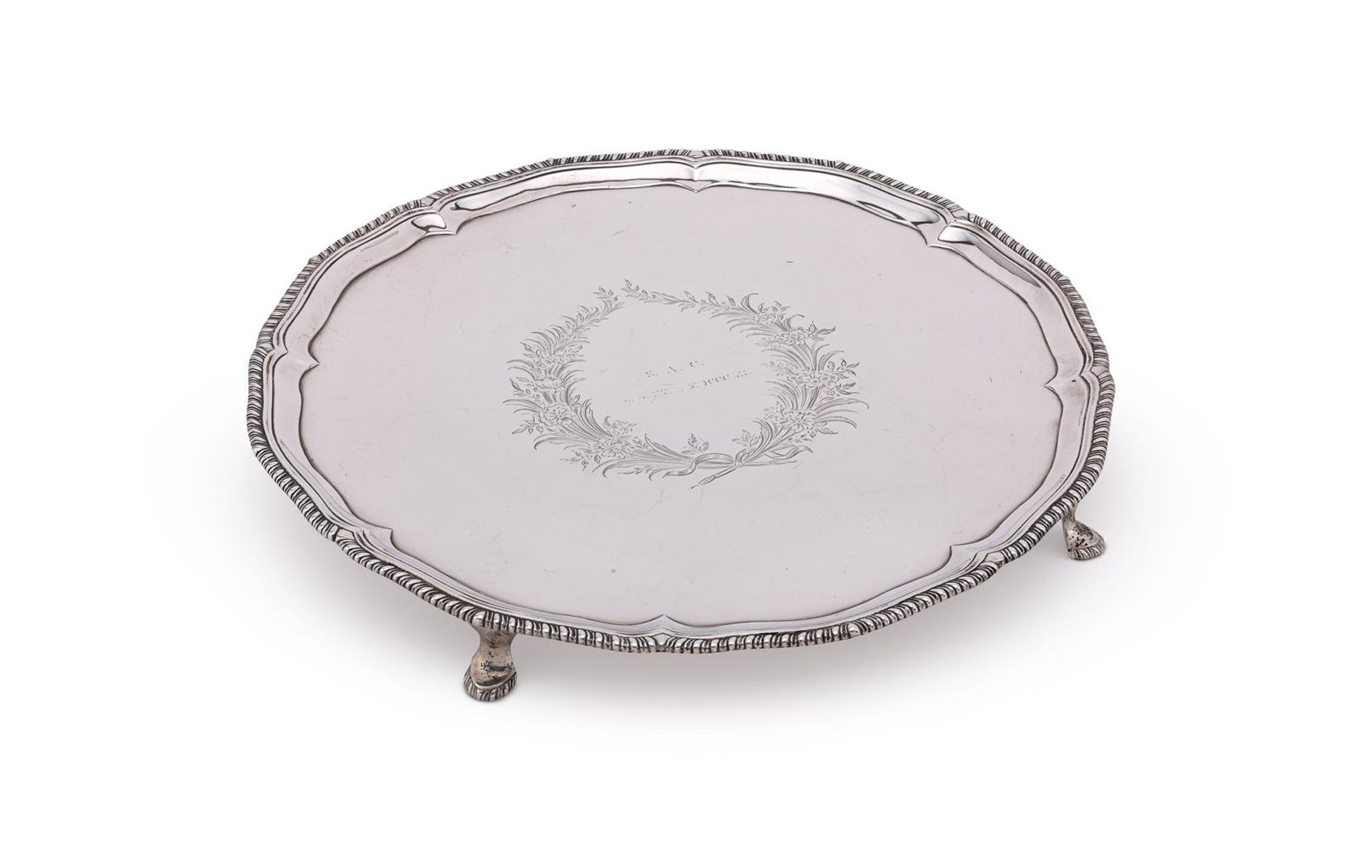 A GEORGE III SILVER SHAPED CIRCULAR SALVER