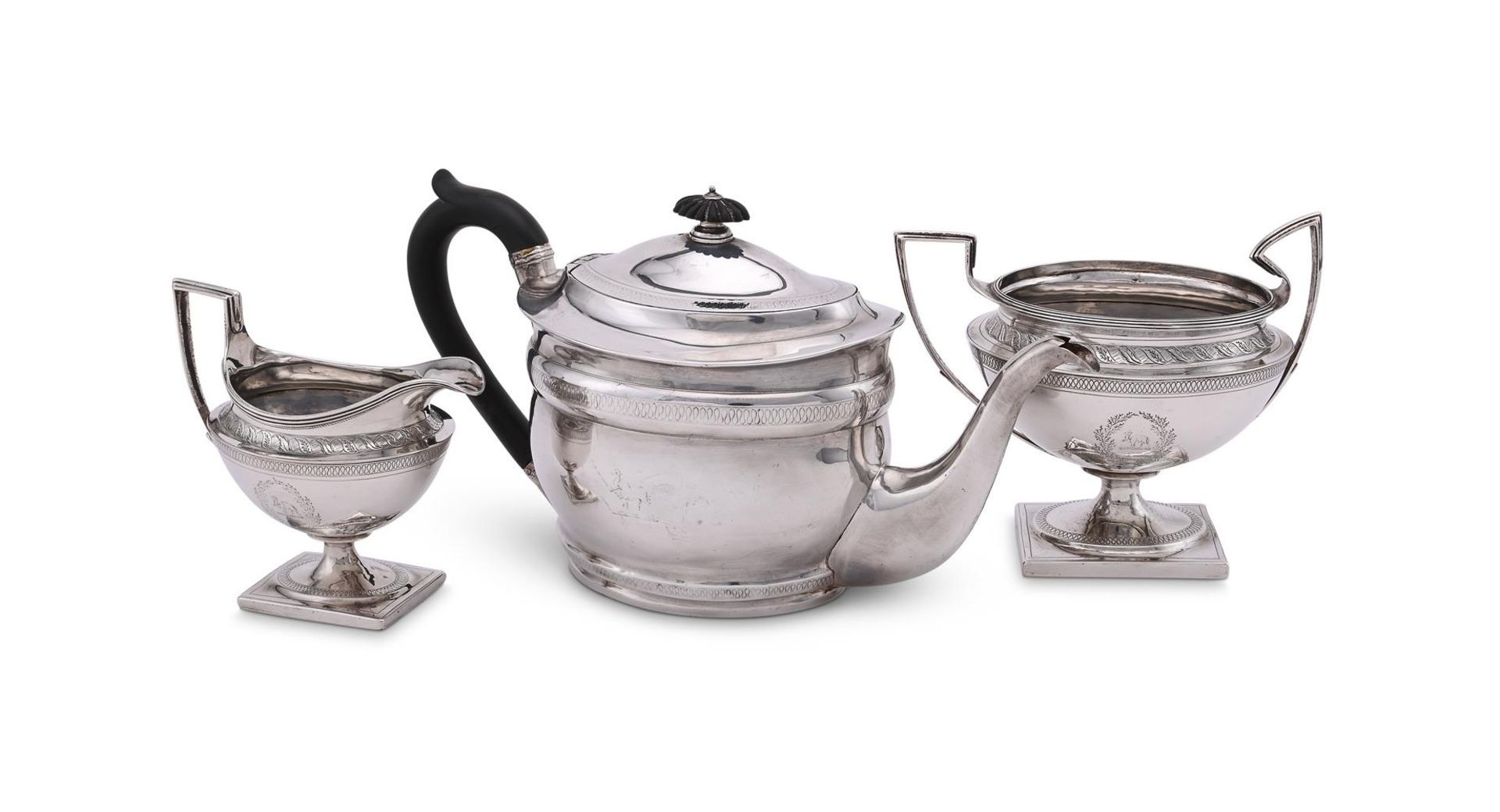 A GEORGE III SILVER OVAL BALUSTER TEA POT