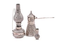 AN EGYPTIAN SILVER COLOURED TAPERING COFFEE POT
