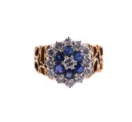 A SAPPHIRE AND DIAMOND CLUSTER RING, CIRCA 1970