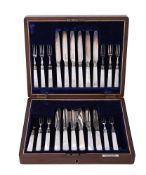 Y A CASED SET OF ELEVEN FRUIT FORKS AND TWELVE FRUT KNIVES WITH SILVER FERRULES