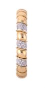 A DIAMOND AND GOLD SPRUNG BANGLE