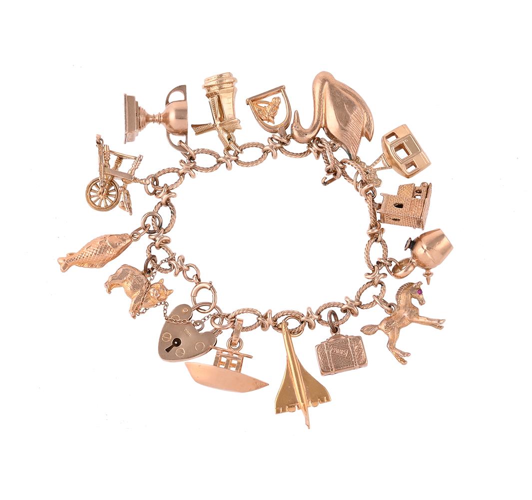 A GOLD COLOURED CHARM BRACELET