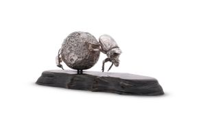 AN AFRICAN SILVER COLOURED MODEL OF A DUNG BEETLE