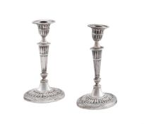 A PAIR OF EDWARDIAN SILVER OVAL CANDLESTICKS