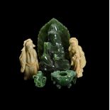 A GROUP OF FOUR JADE AND SOAPSTONE CARVINGS