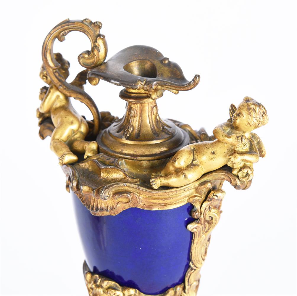 A PAIR OF ORMOLU AND SEVRES STYLE POTTERY EWERS - Image 2 of 2