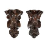 A PAIR OF VICTORIAN CARVED OAK WALL BRACKETS