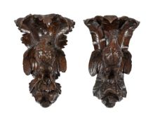 A PAIR OF VICTORIAN CARVED OAK WALL BRACKETS