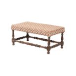 A WALNUT AND UPHOLSTERED STOOL