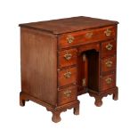 A GEORGE I/II MAHOGANY KNEEHOLE DESK