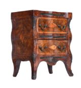 A NORTH EUROPEAN WALNUT MINIATURE CHEST OF DRAWERS