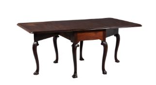 A GEORGE II MAHOGANY DROP LEAF TABLE