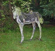 λ HEATHER JANSCH (BRITISH 1948-2021), A DRIFTWOOD MODEL OF A STANDING HORSE