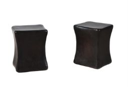 A PAIR OF PATINATED METAL STOOLS