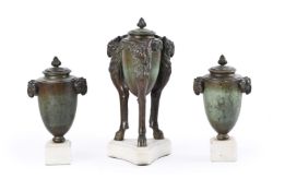 A GARNITURE OF THREE PATINATED BRONZE VASES