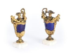 A PAIR OF ORMOLU AND SEVRES STYLE POTTERY EWERS